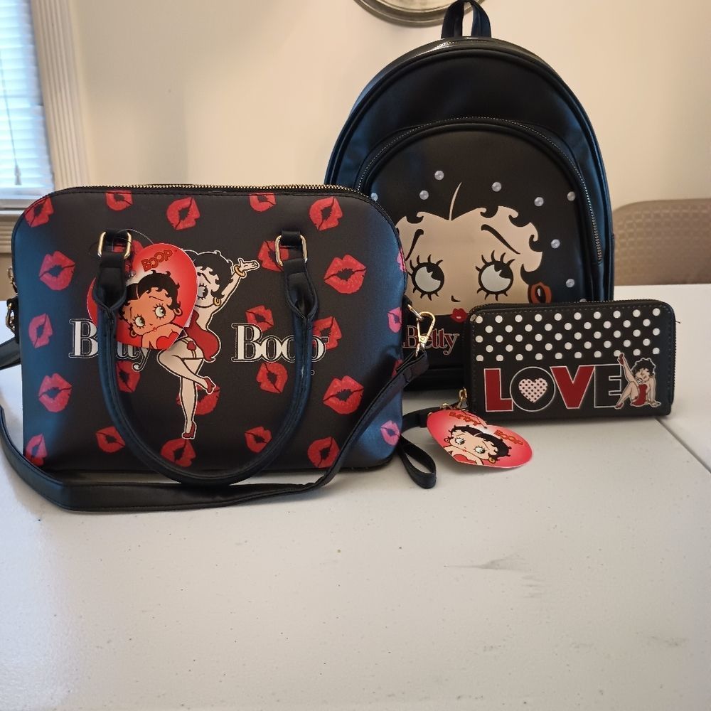 New with tags Betty boop 3-piece set purse backpack and wallet.
